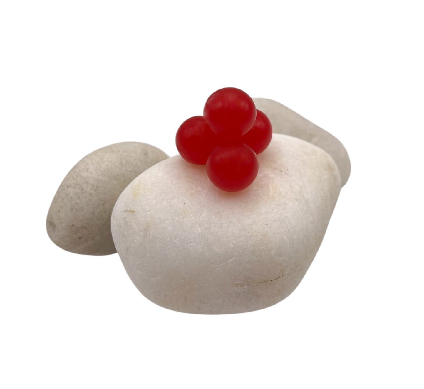 Clear Red soft bead on white rock