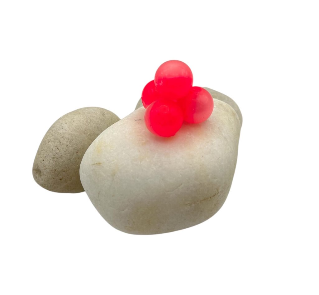 BeadnFloat Soft Beads for BC Fishing 50/50 Hot Pink Soft Beads on white rock