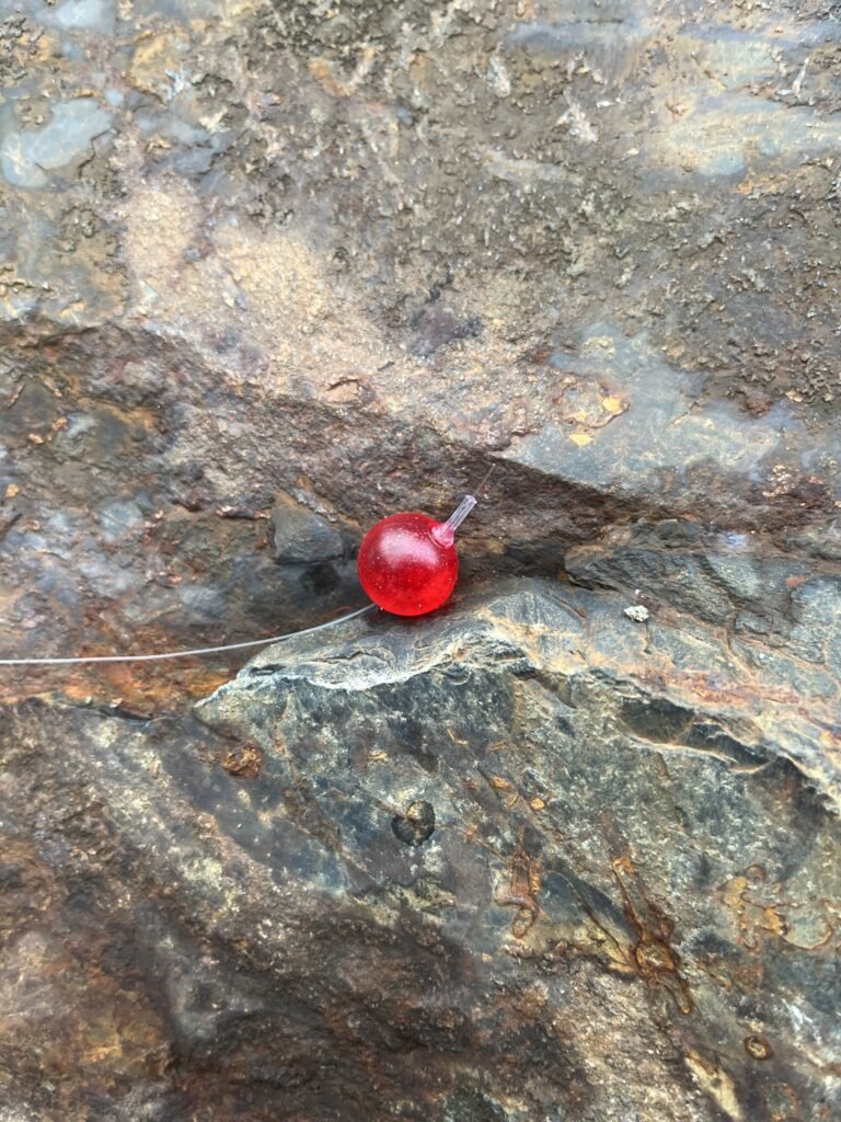 BeadnFloat soft beads in fishing rigs Red Diamond soft bead on rock