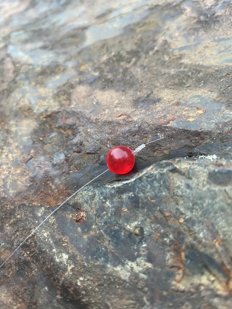 bead strike detection techniques Crimson Red bead on rock
