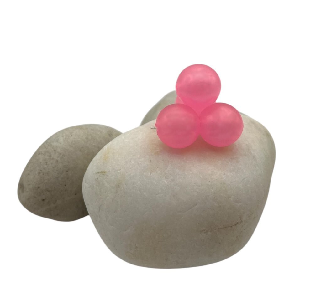 Pink Pearl Soft Beads on white rock