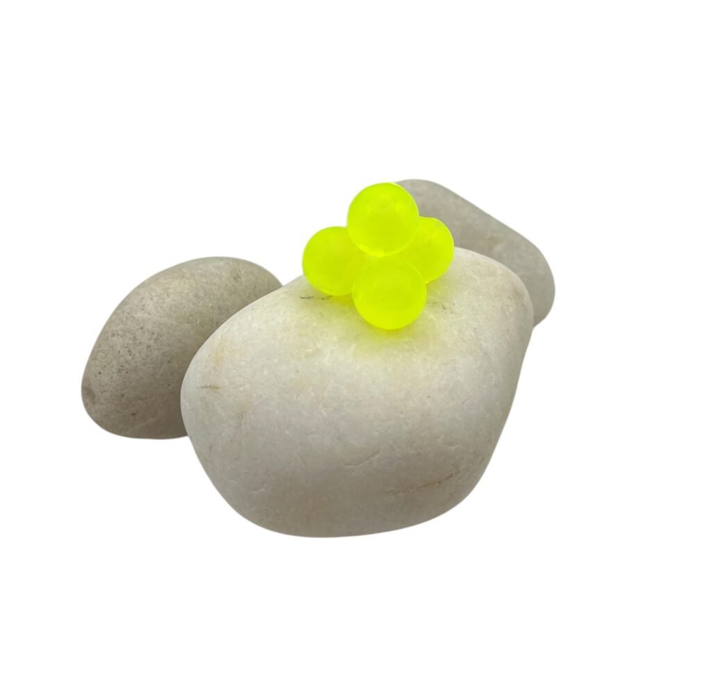 Chartreuse soft bead on white rock